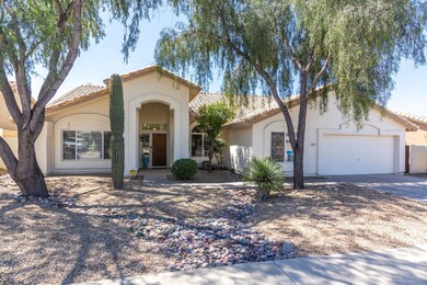 Tatum Ranch home with two car garage.