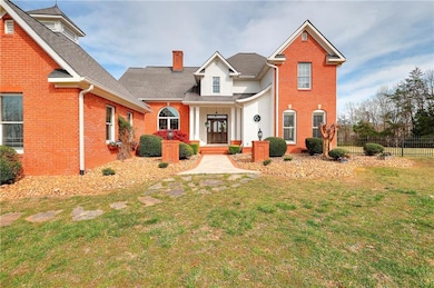 View of front of property with a front lawn, a chi