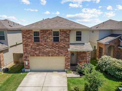 View of front of property featuring driveway, an 
