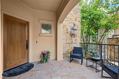 Doorway to property featuring stone siding and st