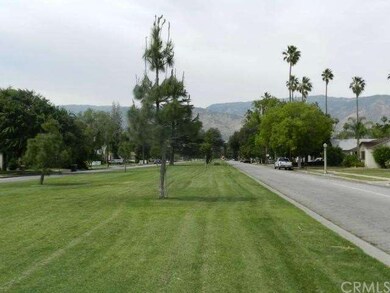 Large Grassy Median Leading to the Foothills