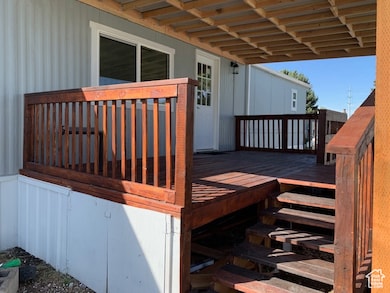 Back View of covered wooden terrace.