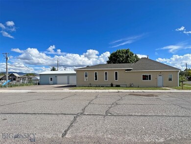 house, paved driveway, garage and play area