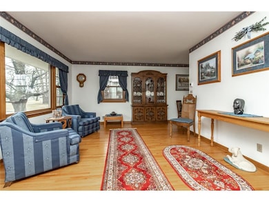 Living room has beautiful oak hardwood floors.