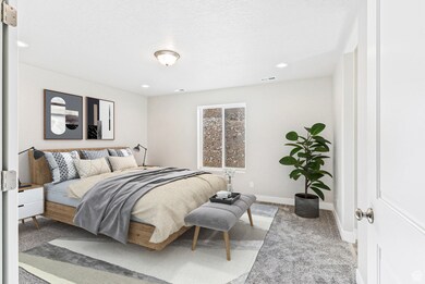 Carpeted bedroom with recessed lighting