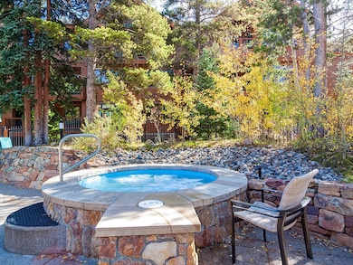 View of swimming pool featuring an in ground hot t