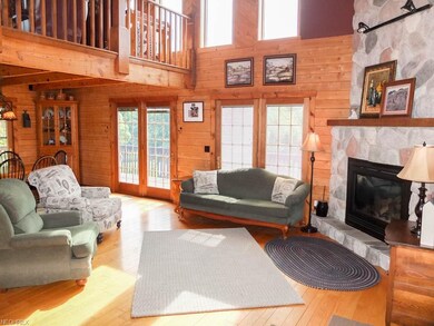 2-story great room with wood flooring featuring a 