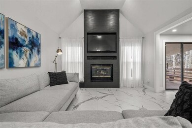 Gorgeous fireplace with tile to the ceiling.