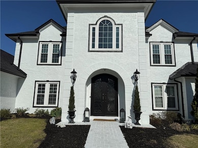 View of front facade with stucco siding