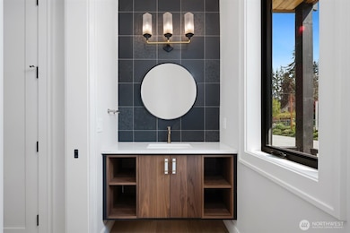 Designer touches everywhere. Floating Belmont walnut cabinet with towel pockets in powder bath on. Main.
