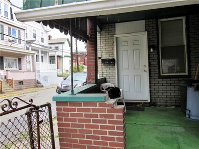 Covered Porch located on Penn St is on Right Side