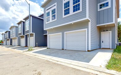 Dark gray home  to the left is a single family hom