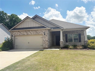 View of front of house featuring brick siding, boa