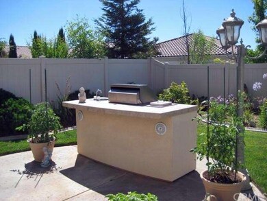 Put up a chair and let's BBQ!  The backyard is perfect for entertaining.  Don't miss the sink, refrigerator and sound system built in.