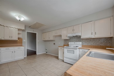 Spacious Kitchen With Ample Storage
This bright,