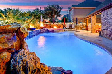 The pool has two fire bowls as well as a grotto with a fountain.