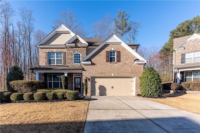 Rear view of house featuring french doors, a lawn,