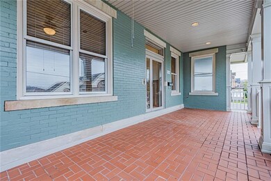 Large Covered front porch is great to relax on