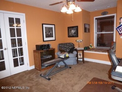 upstairs office/bedroom with balcony