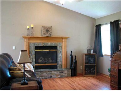 VAULTED LIVING ROOM - Brick-Framed Fireplace with 