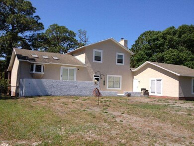 Back of home showing Mother-in-law Suite