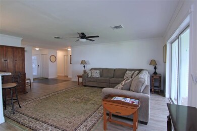 View of Foyer, Dining and Kitchen from the Living