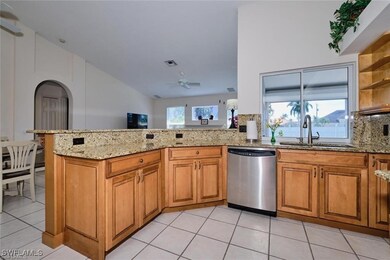 Kitchen with stainless steel dishwasher, a sink, l