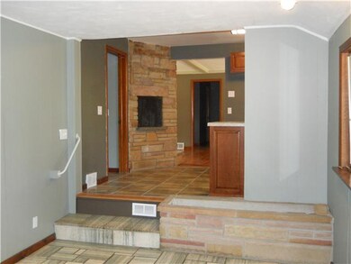 Kitchen Two steps leads from breakfast room/family