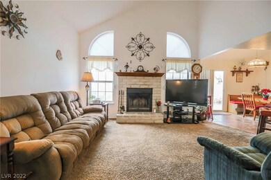Great room features 17' ceilings, wood-burning fir