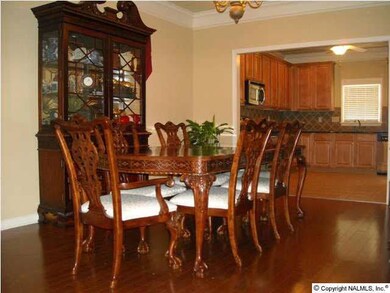 Gorgeous Dining Area with Hardwood Floors, Crown Molding