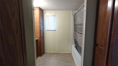 Bathroom featuring shower / bath combo with shower
