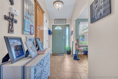 Foyer entrance with tile patterned floors