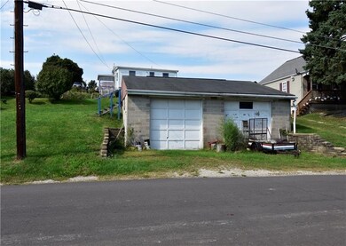 Rear view of the HUGE 2+ stall, commercial style garage, with man door.