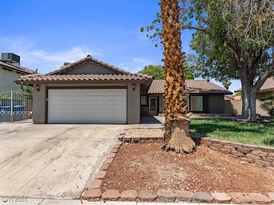 View of front of house with an attached garage, co