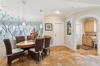 Breakfast Area: Curved planter in breakfast area. Excluded from the sale: Glass Partitions in dining room.