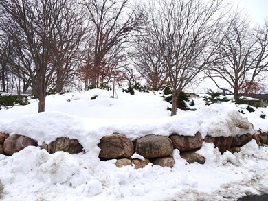 Boulder landscaping to left of unit