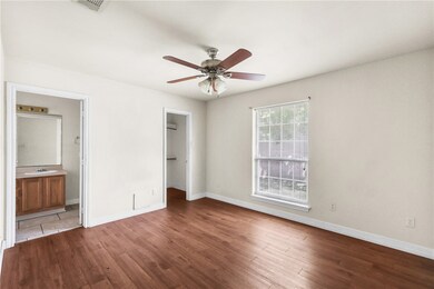 Unfurnished bedroom with dark wood finished floors