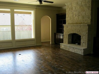 Family room with wall of windows.