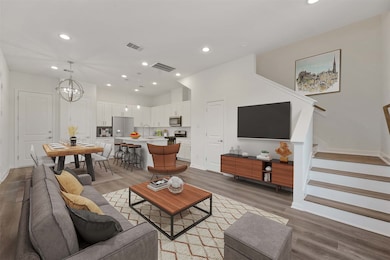 Bottom floor open concept living photo is virtuall