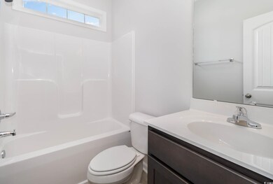 Full bathroom with vanity, toilet, and bathtub / s
