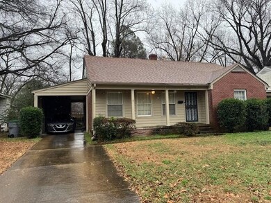 Ranch-style house featuring a carport and a front 