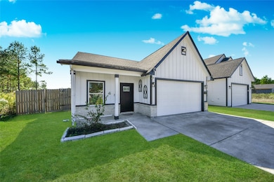 Detailed shot highlighting the covered front porch, decorative window trim, and the attractive mix of white siding and stone accent skirting.
