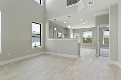 Unfurnished living room with light wood finished 