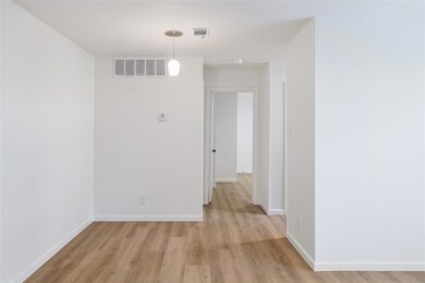 Spare room featuring light wood-style floors and 