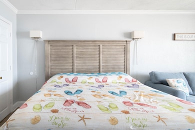 Bedroom featuring ornamental molding