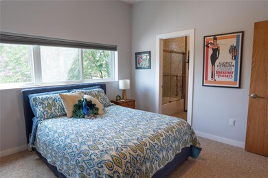 Bedroom with carpet and ensuite bathroom