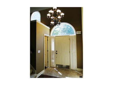 entry way with tile flooring, half bath & GORGEOUS