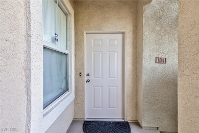 Entrance to property featuring stucco siding