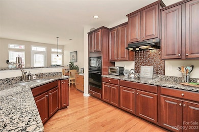 Fall in love with the Custom Cherry Cabinets and Granite Countertops! The Wall Oven with Convection/Microwave
