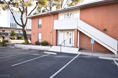 View of property with uncovered parking